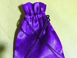 Da mojo bag theory of possessing divine power in da contents chosen when worn for magical purposes 